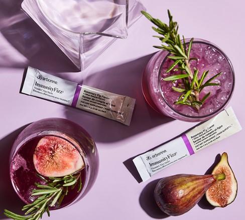 Arbonne Immunity Fizz sticks with berry drinks and figs