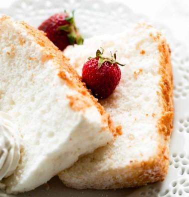 Slices of angel food cake with fresh strawberries
