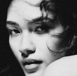 Black-and-white portrait of singer Olivia Dean